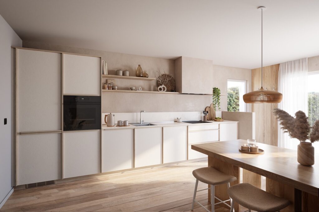 Cuisine beige et bois clair avec colonnes de rangement, four encastré noir, évier sous étagères ouvertes, table en bois au premier plan et suspension tressée.