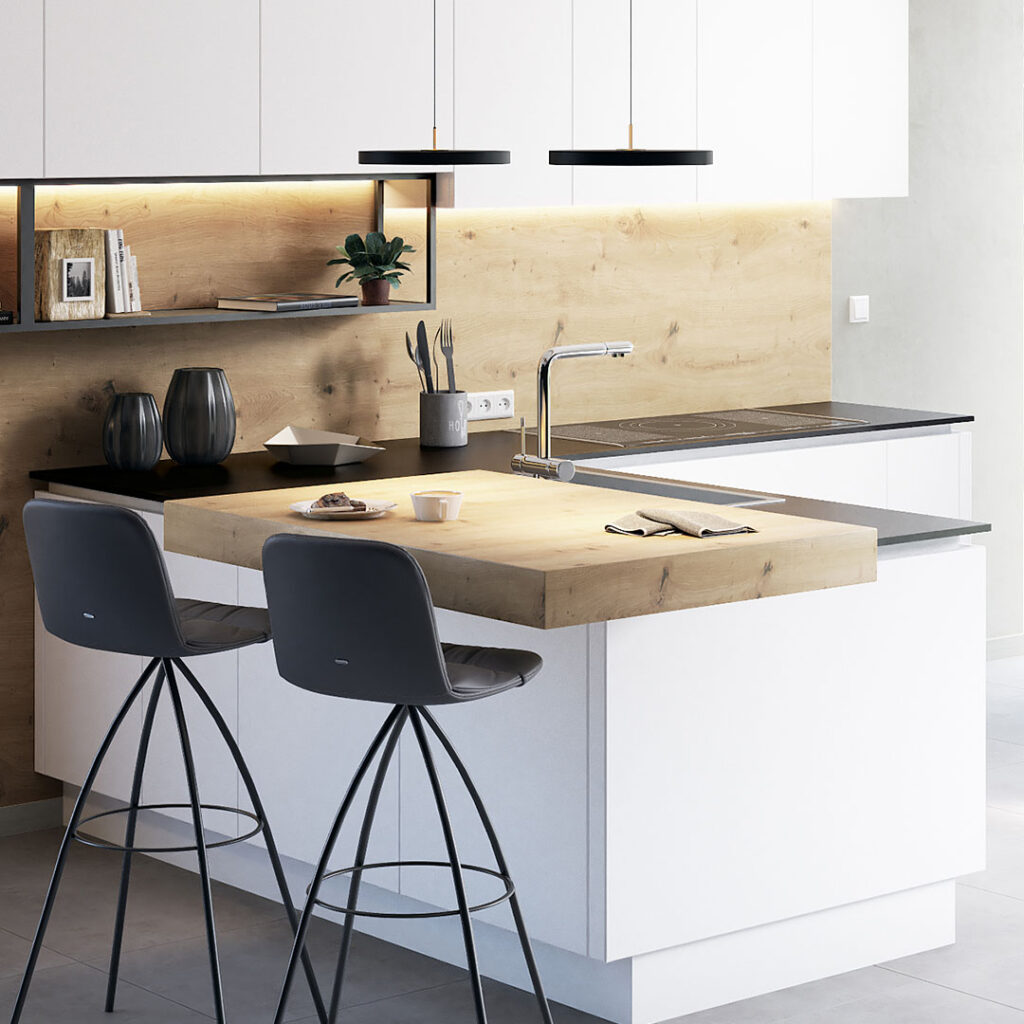 Cuisine moderne avec îlot blanc et plan de travail en bois clair, deux tabourets noirs, évier chromé, plaque de cuisson noire et meubles suspendus blancs.
